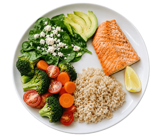 Dinner plate with salmon, brown rice, broccoli, carrots, tomatoes, and spinach